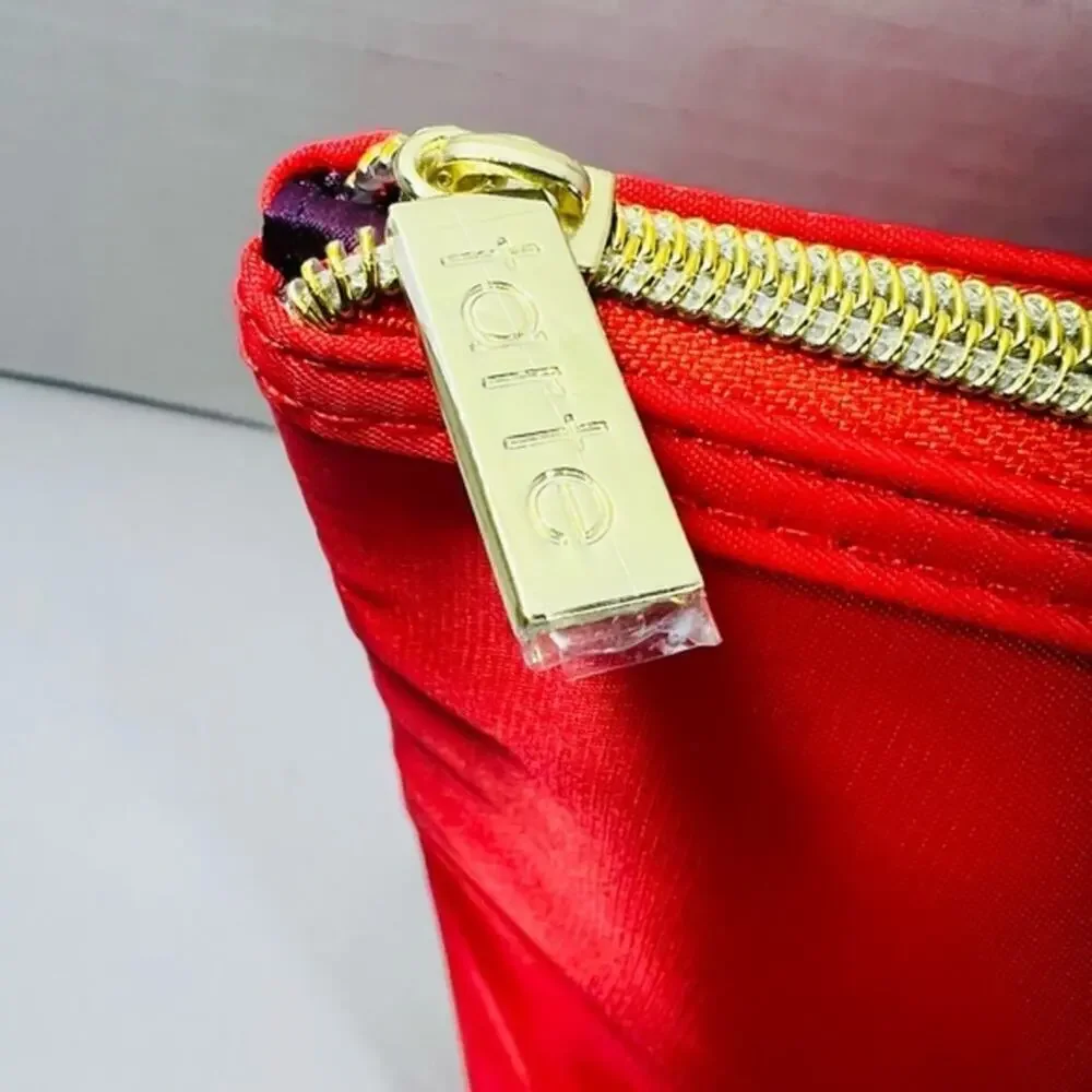 Tarte red cosmetic bag/ clutch, nice size with beautiful purple satin interior